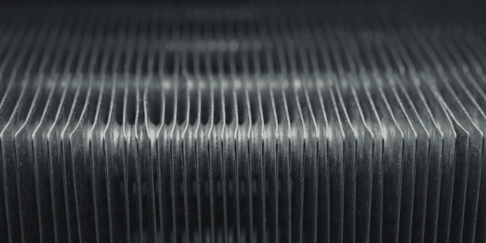 Macro of an aluminium fin coil pack, fin edges catching light